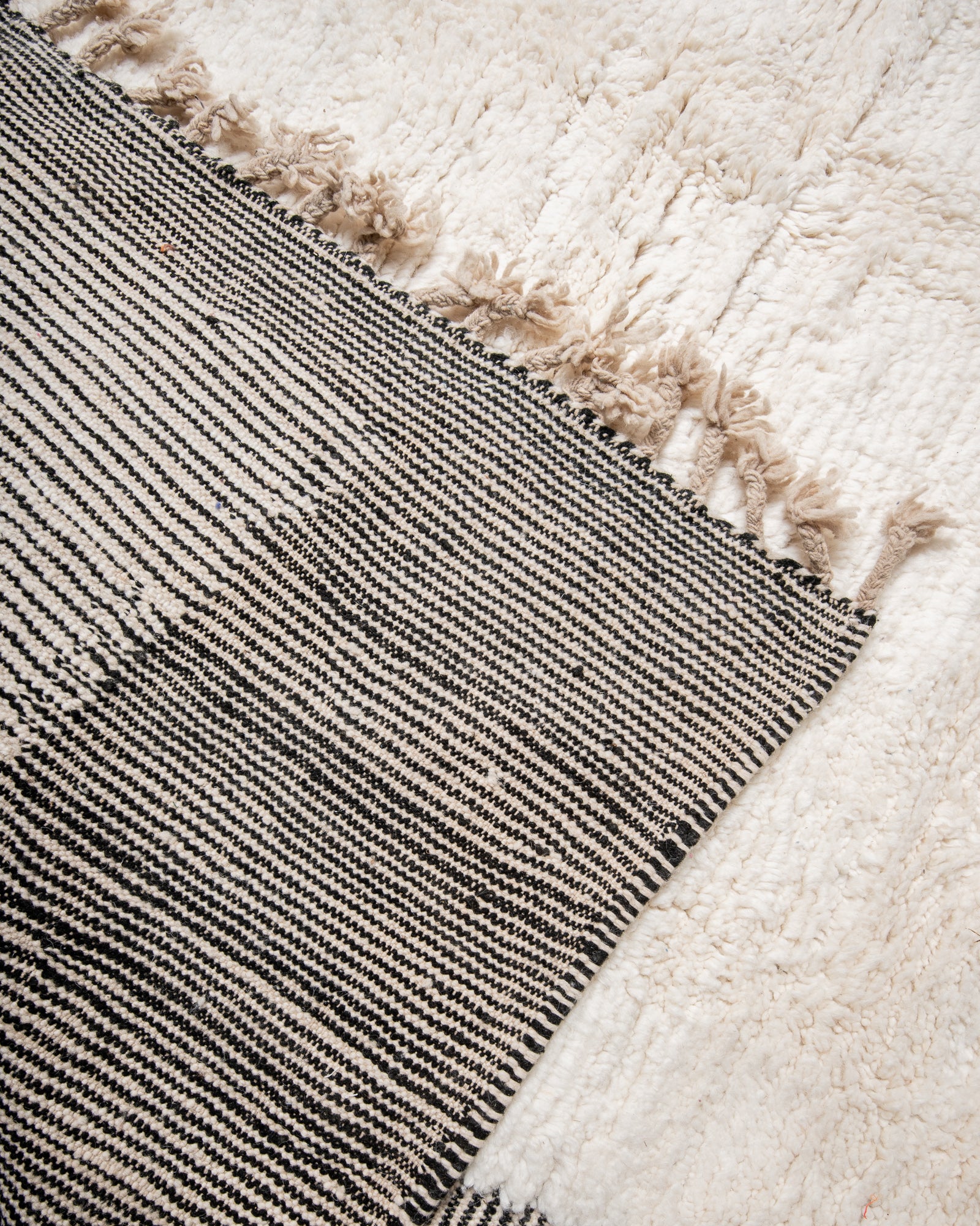 Modern, designer, handcrafted Berber rug from Morocco. Beniourain carpet with beautiful colours and patterns and fluffy wool texture.